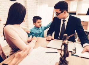 A father, mother and son speaking in a family law attorney's office in Henderson, NV