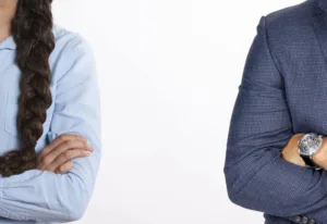 divorce concept with couple apart folding arms