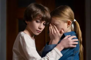 child custody concept of siblings learning they will be separated from parents divorce