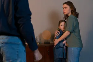 child custody concept of mother protecting daughter from father by seeking temporary sole custody